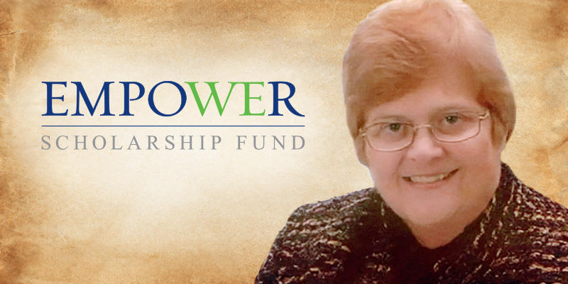 A headshot of Kathy Modene with the Empower Scholarship Fund logo