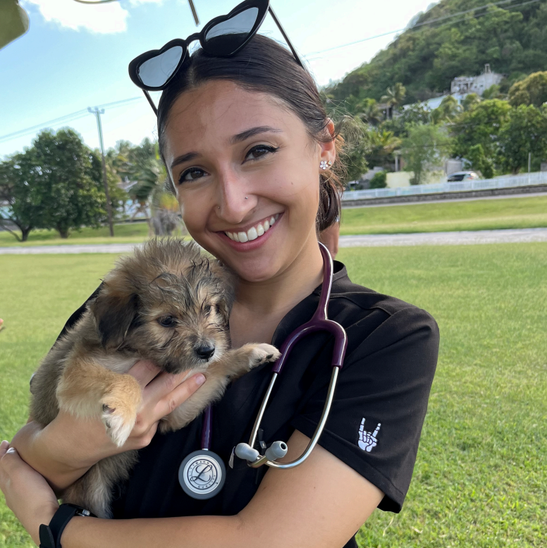 Isabella Minacapilli holding a dog